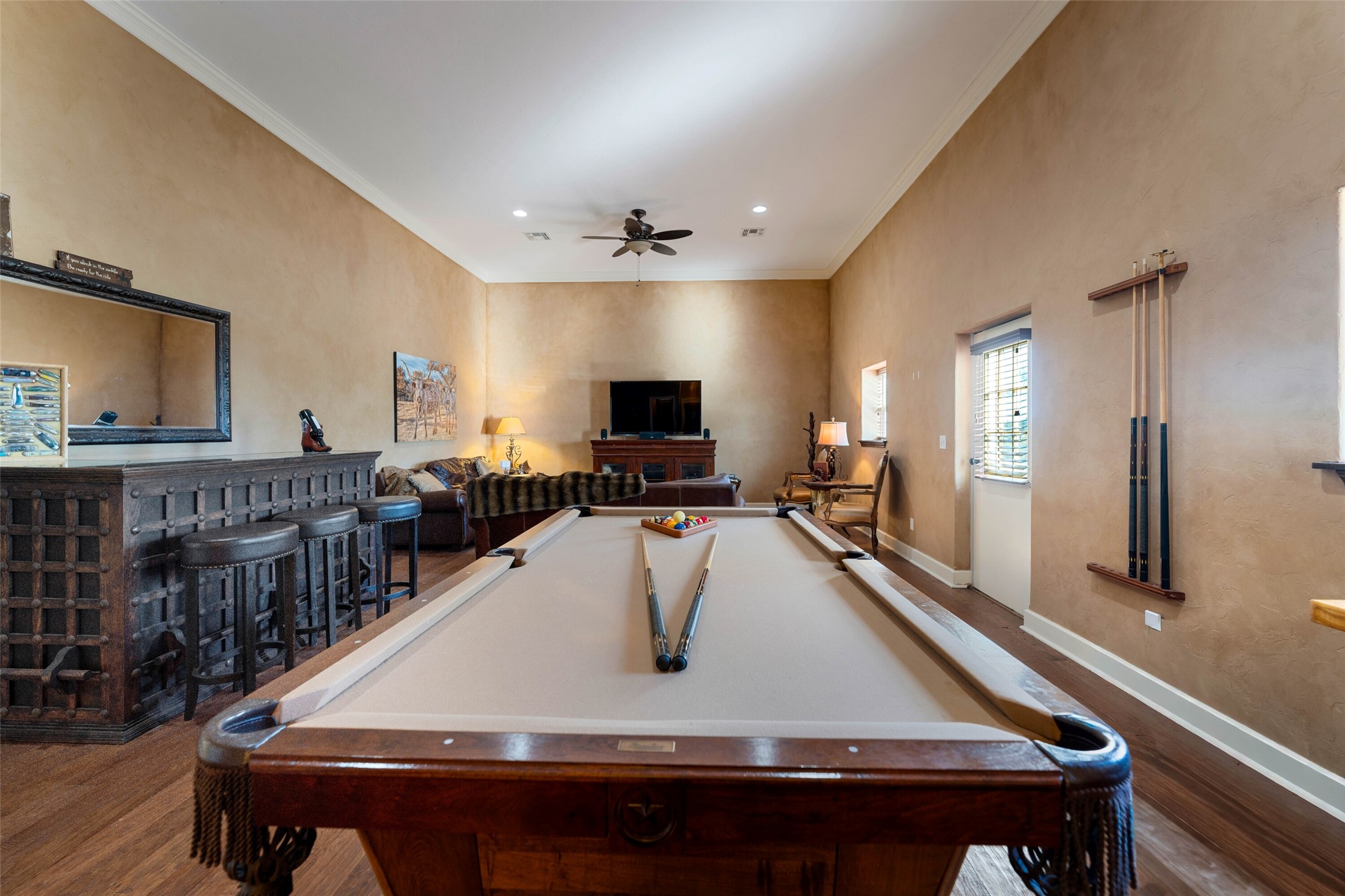 7702 Ranch Road 965 Llano, TX 78643 - Photo 14 of 40 a room with furniture pool table flat screen tv and windows