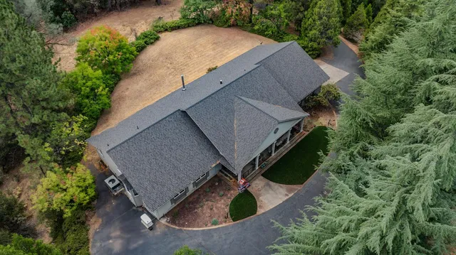 a kitchen with stainless steel appliances granite countertop a stove top oven a sink dishwasher and cabinets with wooden floor