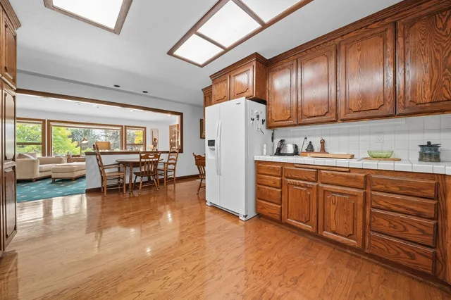 a bathroom with a double vanity sink mirror and shower