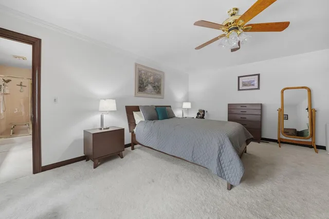 a living room with furniture floor to ceiling window and a table