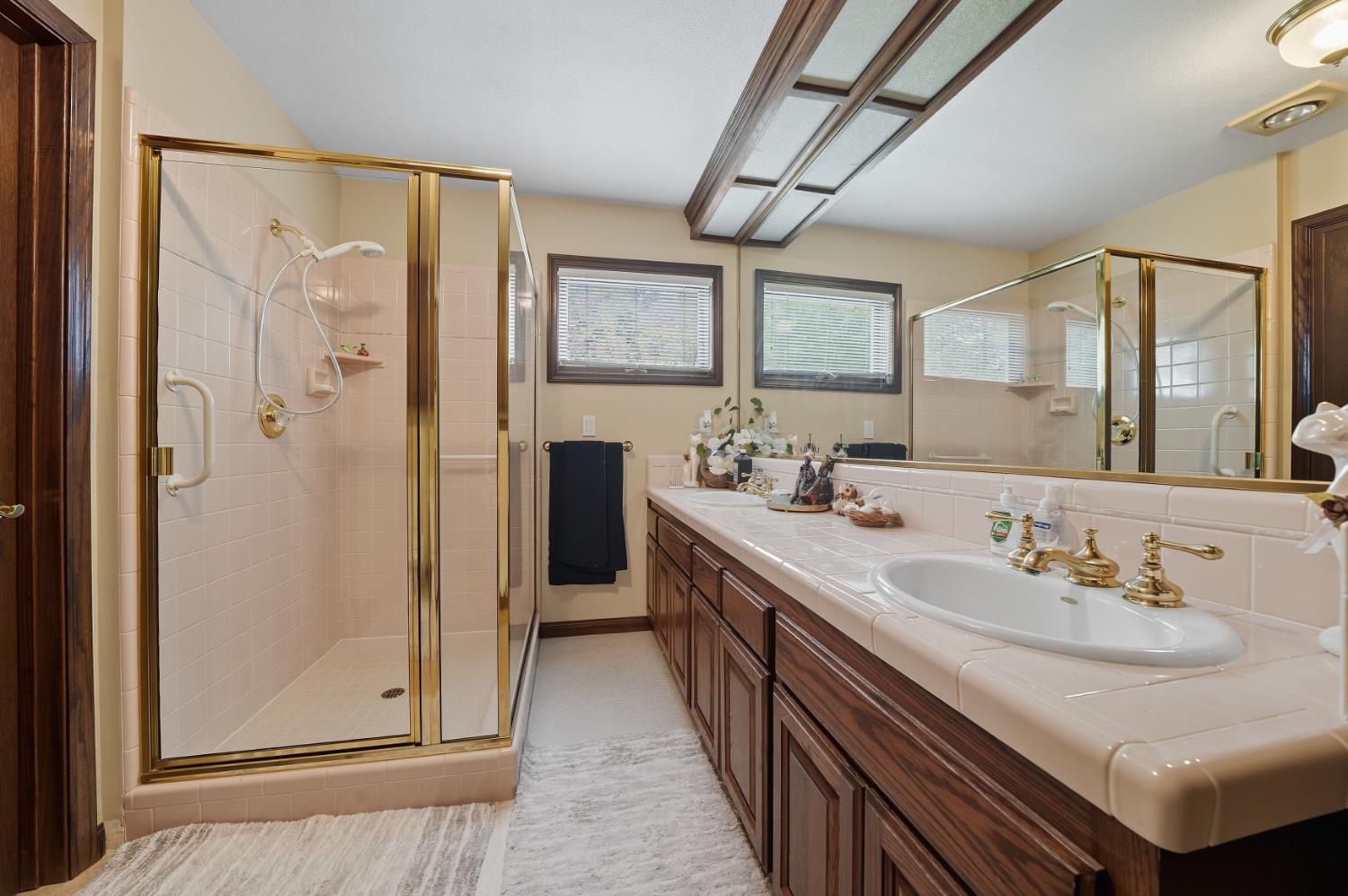 19491 East Clinton Road Jackson, CA 95642 - Photo 41 of 72 a bathroom with a double vanity sink mirror and shower