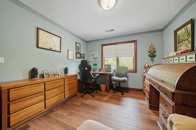 a room with furniture a rug and a window