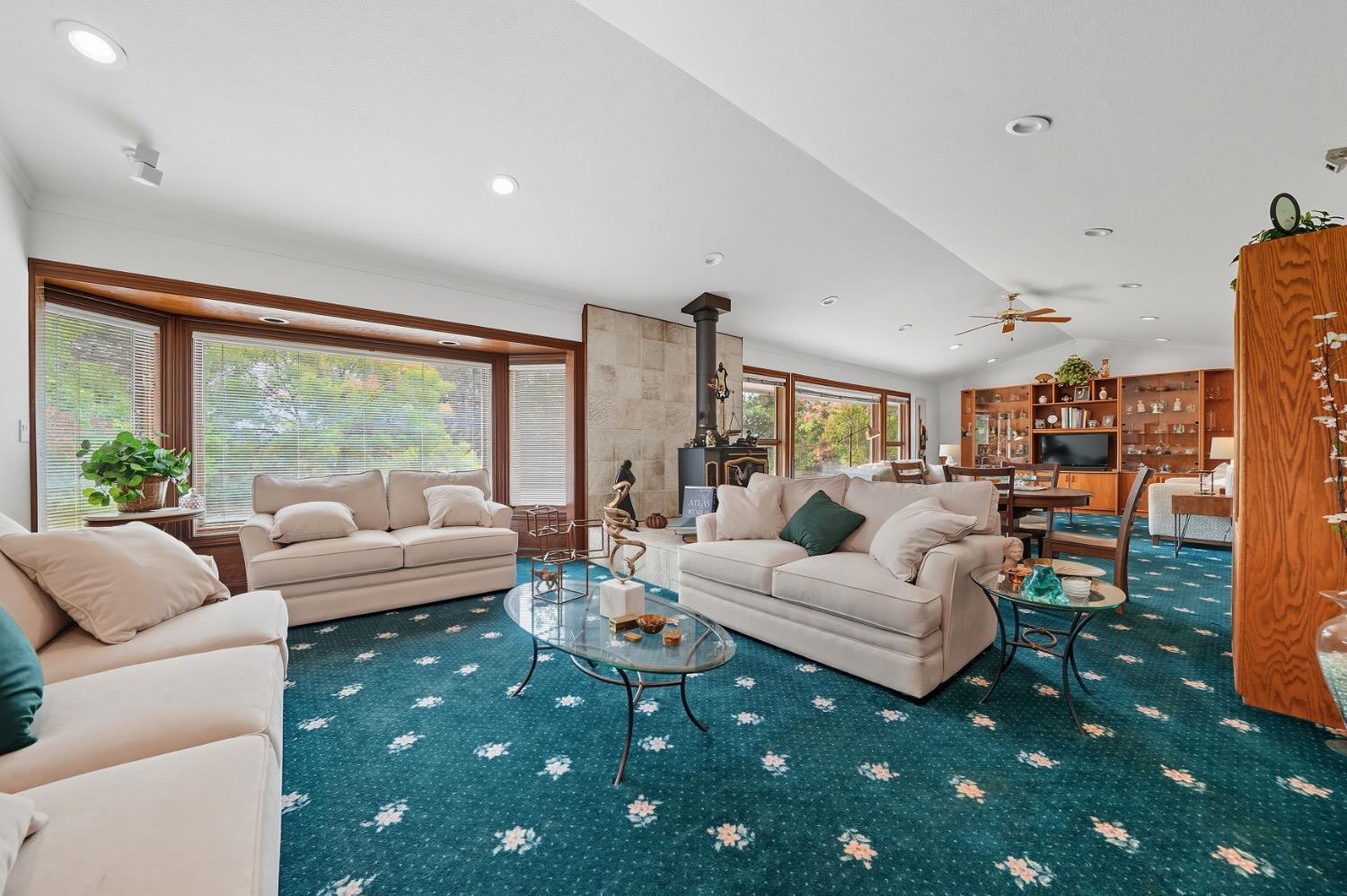 19491 East Clinton Road Jackson, CA 95642 - Photo 51 of 72 a living room with furniture floor to ceiling window and a table