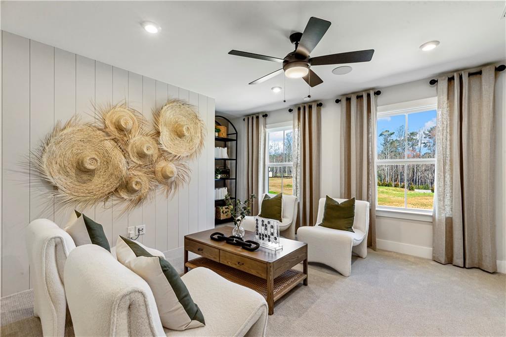 239 Rockledge Bend Powder Springs, GA 30127 - Photo 11 of 14 a living room with furniture and a large window