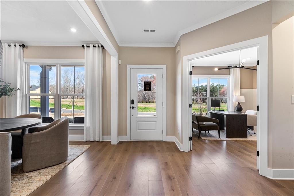 239 Rockledge Bend Powder Springs, GA 30127 - Photo 3 of 14 a view of a livingroom with furniture wooden floor and windows