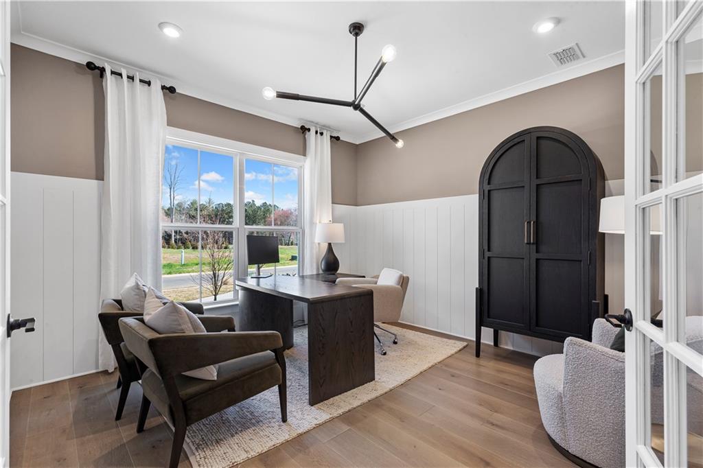 239 Rockledge Bend Powder Springs, GA 30127 - Photo 4 of 14 a living room with furniture a large window and wooden floor