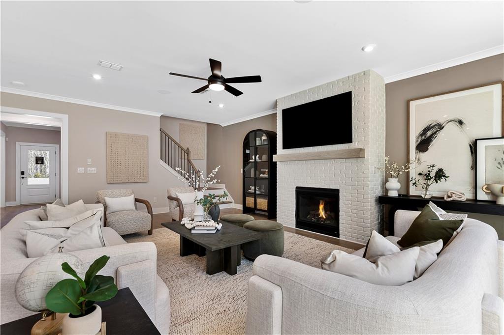 239 Rockledge Bend Powder Springs, GA 30127 - Photo 6 of 14 a living room with furniture fireplace and flat screen tv
