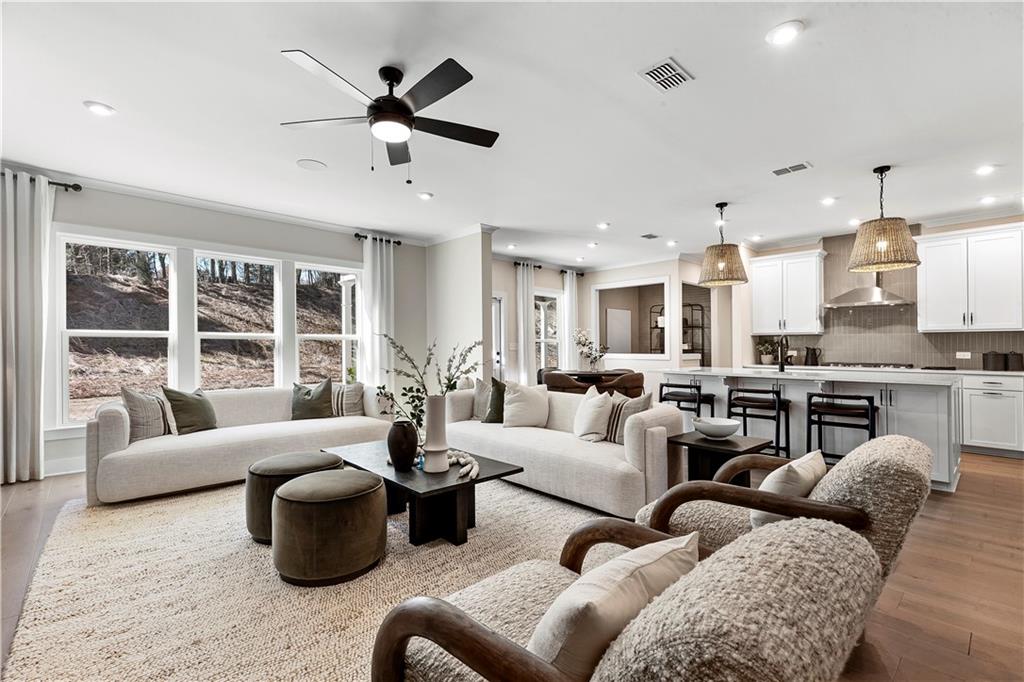 239 Rockledge Bend Powder Springs, GA 30127 - Photo 7 of 14 a living room with furniture kitchen view and large windows
