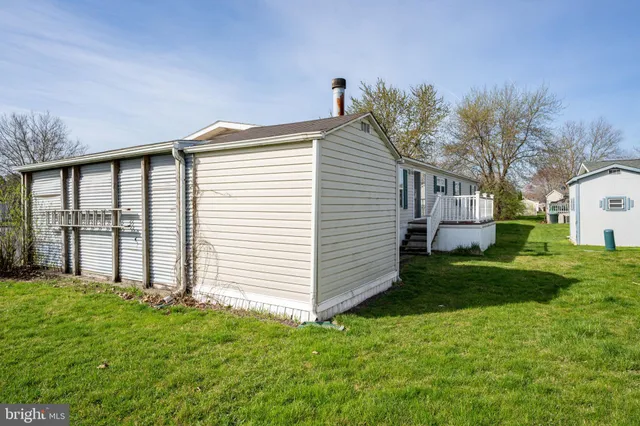 a view of a livingroom with an empty space and a window
