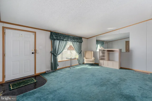 a view of dining room with furniture and a table