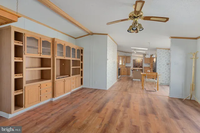 a bathroom with a granite countertop sink a mirror and a bathtub