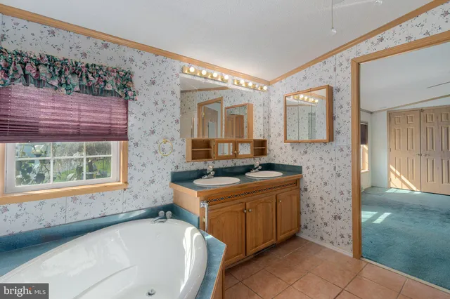 a view of a livingroom with a ceiling fan and window