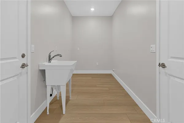 a bathroom with a sink and mirror