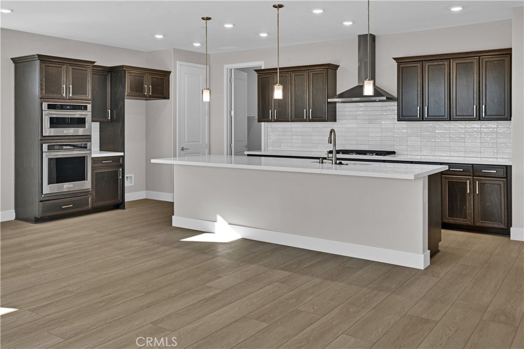 3718 Rhone Road Paso Robles, CA 93446 - Photo 3 of 17 a large kitchen with stainless steel appliances granite countertop a stove a sink and a refrigerator