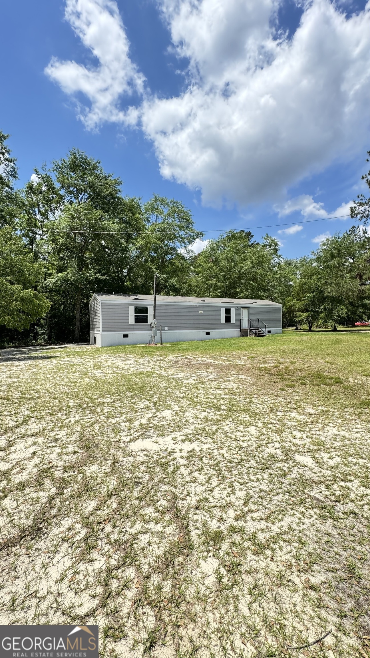 1227 Carters Bridge Road Claxton, GA 30417 - Photo 1 of 1 a view of a swimming pool with an ocean view