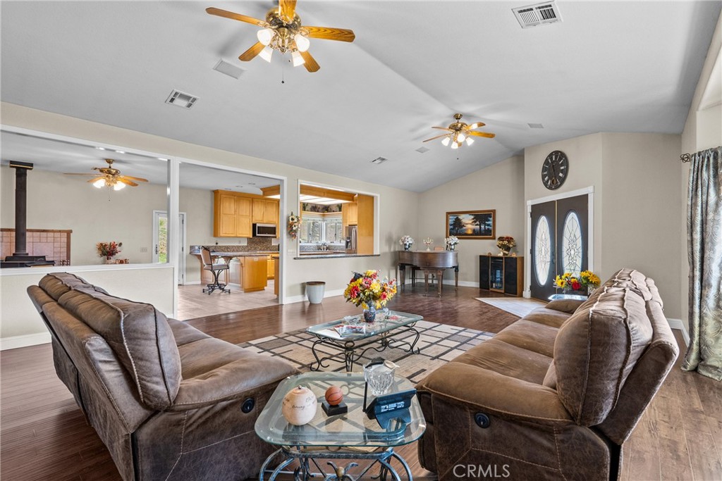 40647 Shallow Springs Road Leona Valley, CA 93551 - Photo 12 of 41 a living room with furniture a chandelier and a dining table