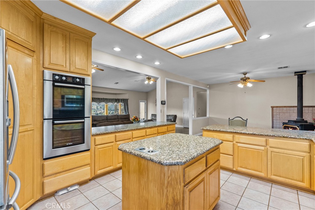 40647 Shallow Springs Road Leona Valley, CA 93551 - Photo 15 of 41 a kitchen with stainless steel appliances granite countertop a sink and cabinets