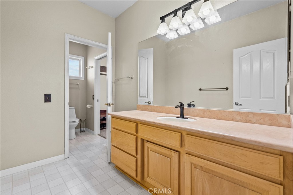 40647 Shallow Springs Road Leona Valley, CA 93551 - Photo 25 of 41 a bathroom with a sink a mirror and a shower