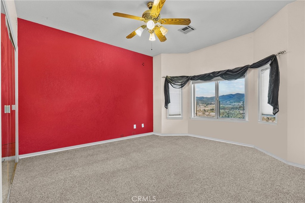 40647 Shallow Springs Road Leona Valley, CA 93551 - Photo 27 of 41 an empty room with windows and fan