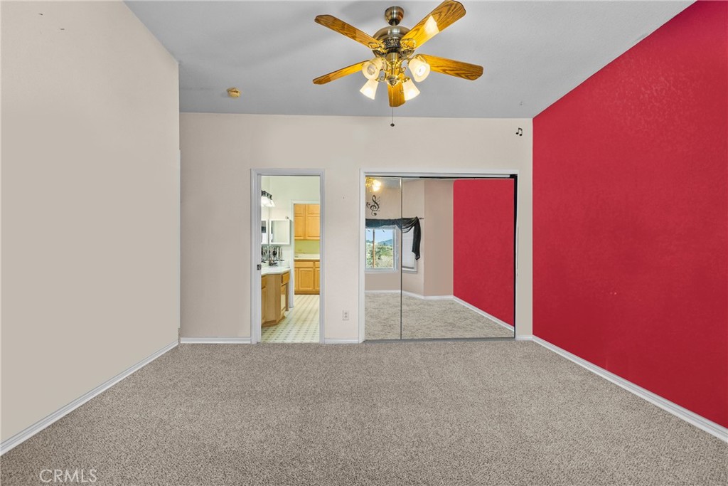 40647 Shallow Springs Road Leona Valley, CA 93551 - Photo 29 of 41 a view of a livingroom with a ceiling fan and window