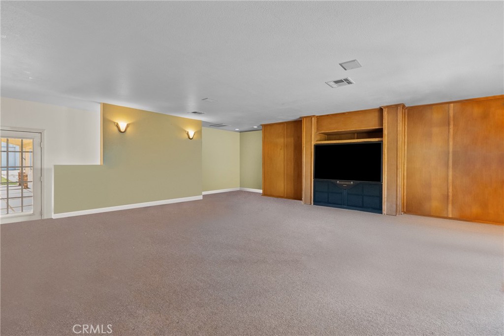 40647 Shallow Springs Road Leona Valley, CA 93551 - Photo 36 of 41 a view of an empty room with a fireplace