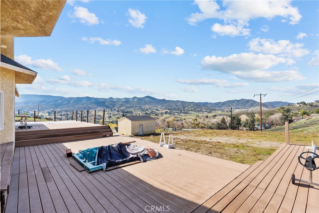 40647 Shallow Springs Road Leona Valley, CA 93551 - Photo 39 of 41 a view of a terrace with wooden floor and lake view