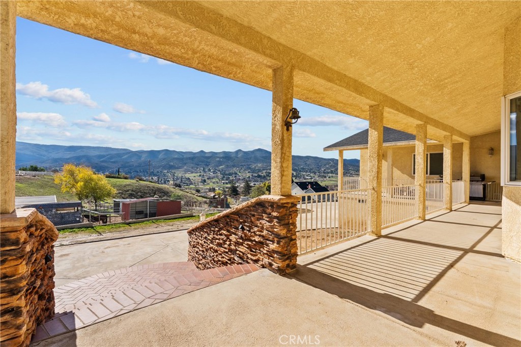 40647 Shallow Springs Road Leona Valley, CA 93551 - Photo 8 of 41 a view of a balcony with couches and sky view