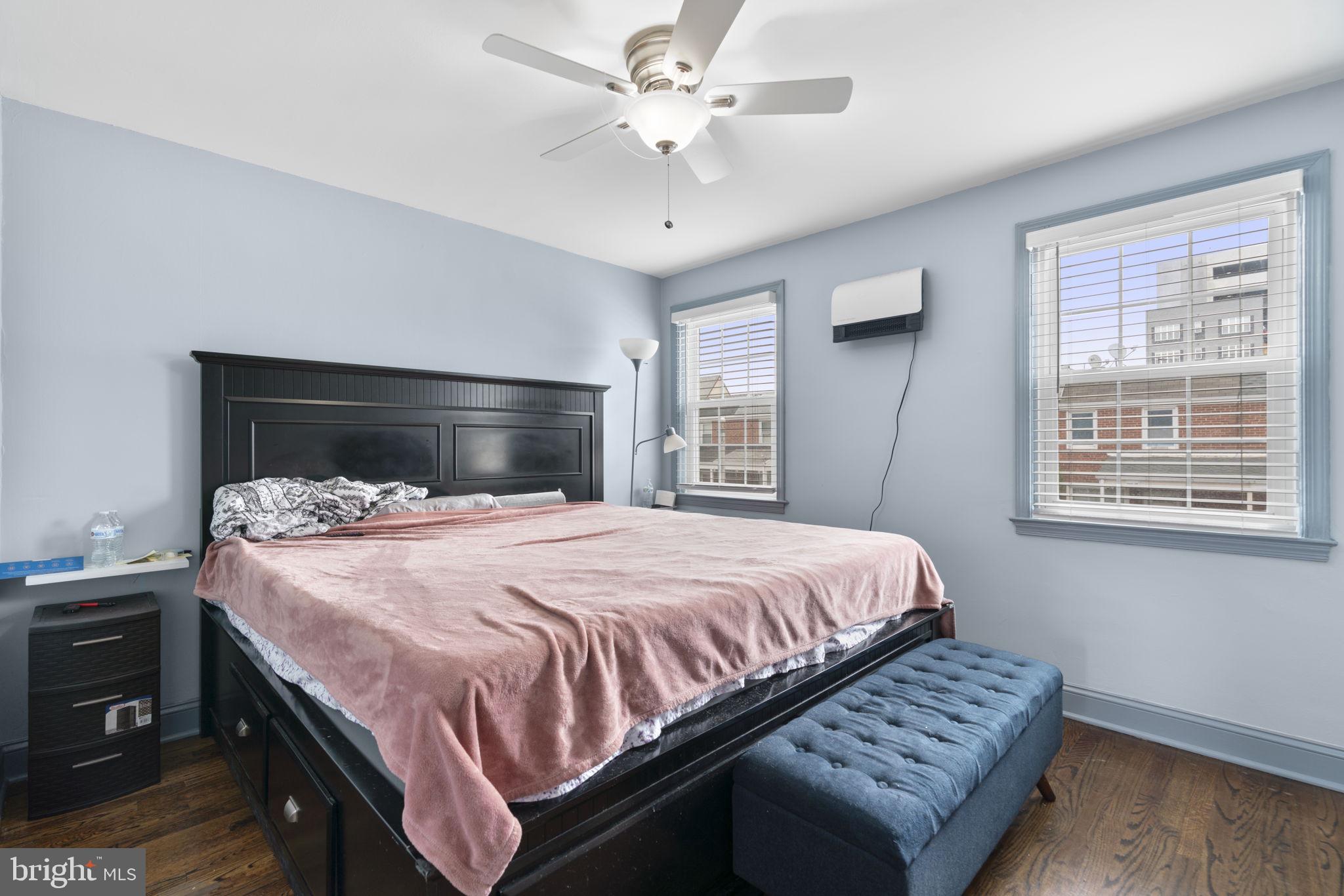 514 Umbra Street Baltimore, MD 21224 - Photo 17 of 37 a bedroom with a bed and a ceiling fan