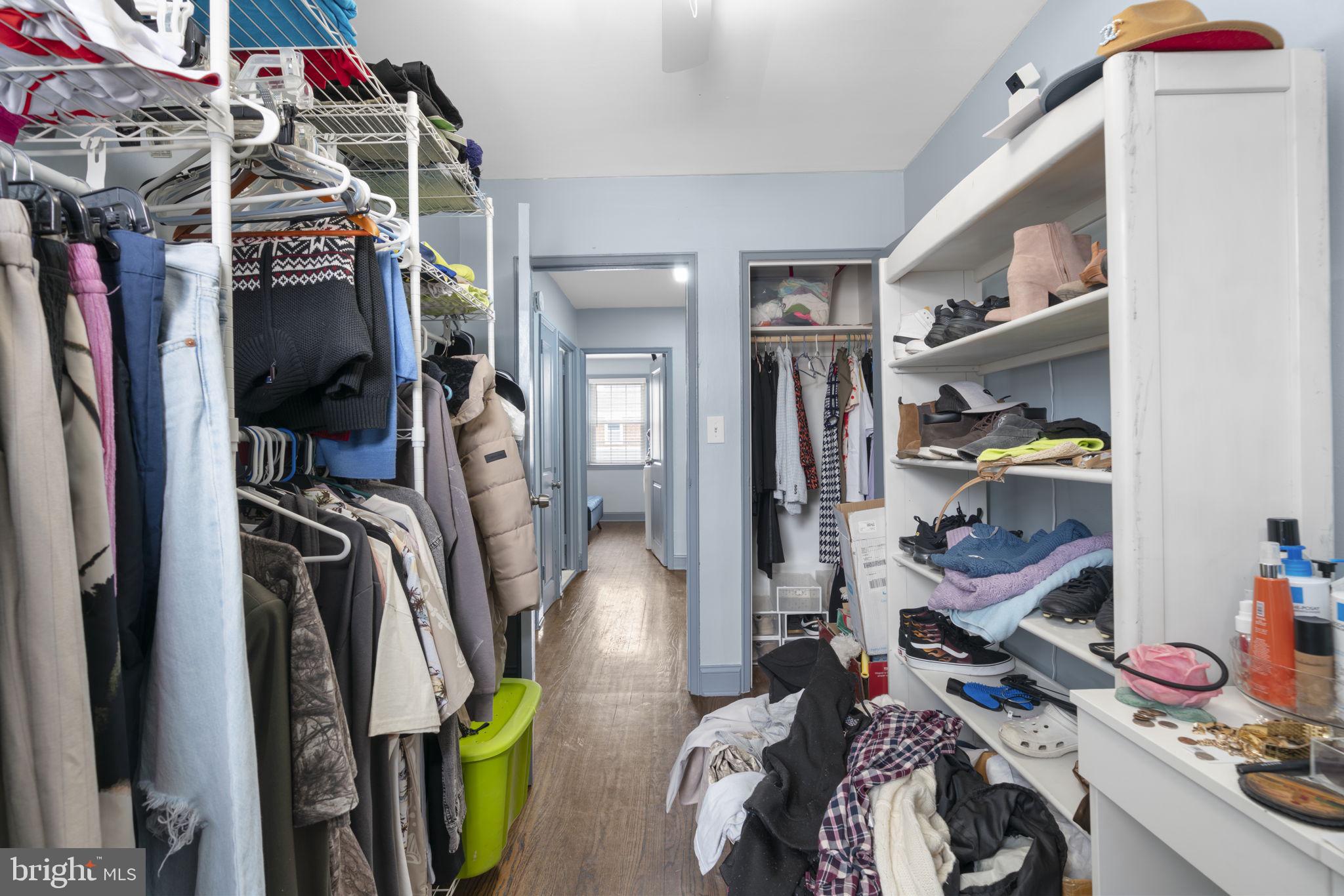 514 Umbra Street Baltimore, MD 21224 - Photo 21 of 37 a view of walk in closet with clothes and shoes