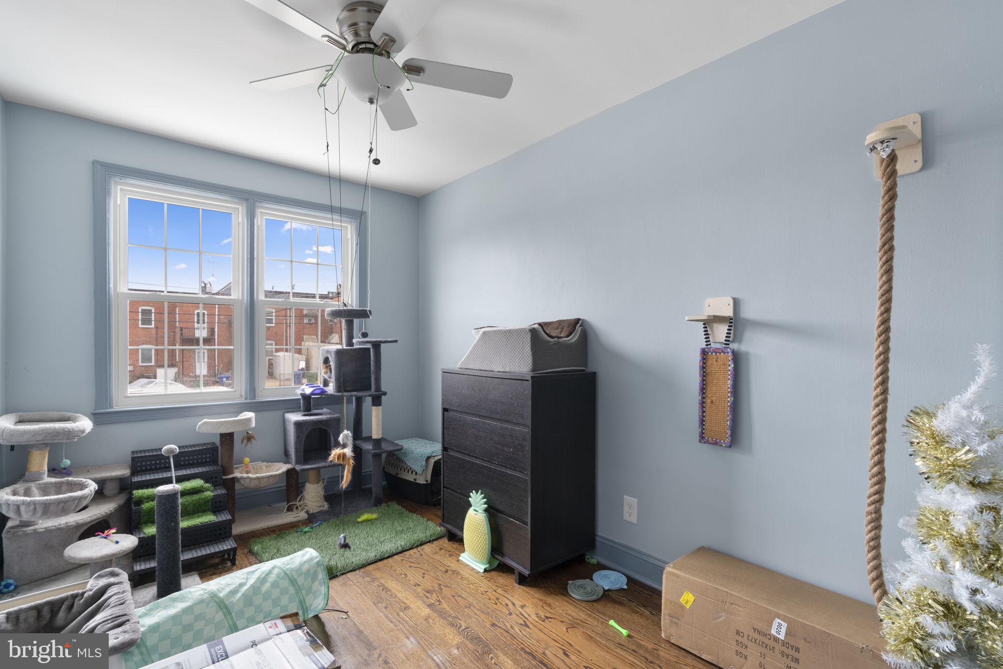 514 Umbra Street Baltimore, MD 21224 - Photo 22 of 37 a living room with furniture and a flat screen tv