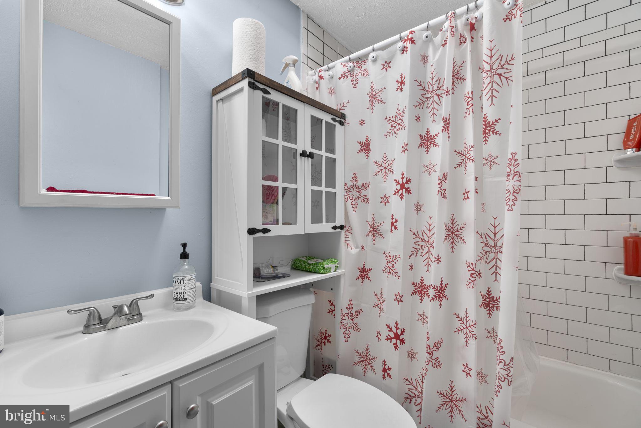 514 Umbra Street Baltimore, MD 21224 - Photo 24 of 37 a bathroom with a sink toilet and shower