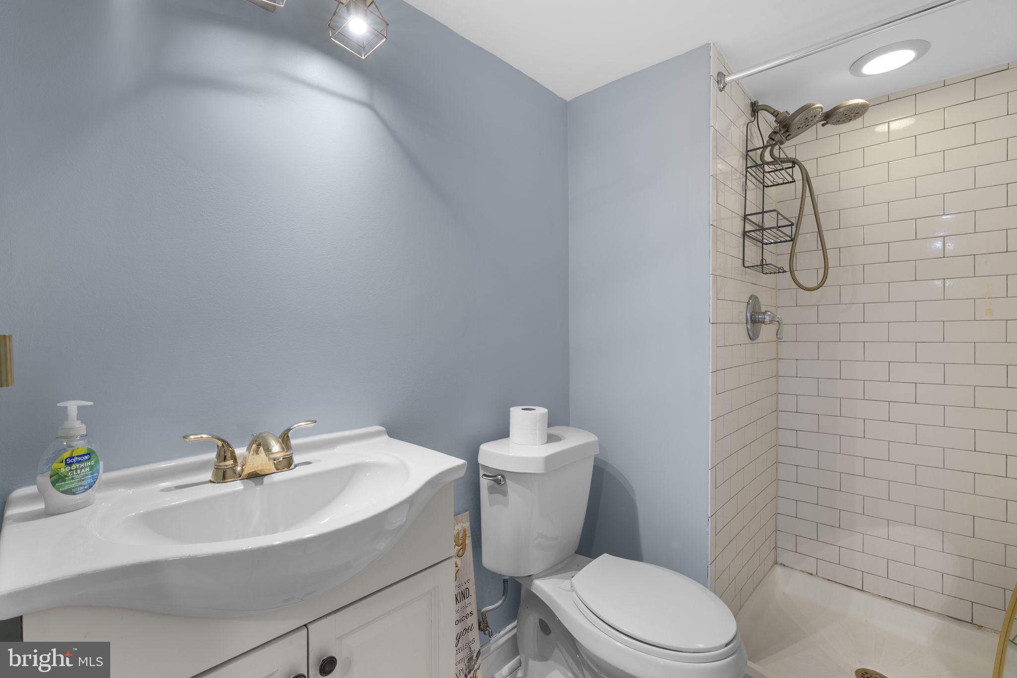 514 Umbra Street Baltimore, MD 21224 - Photo 27 of 37 a white toilet sitting next to a bathroom sink