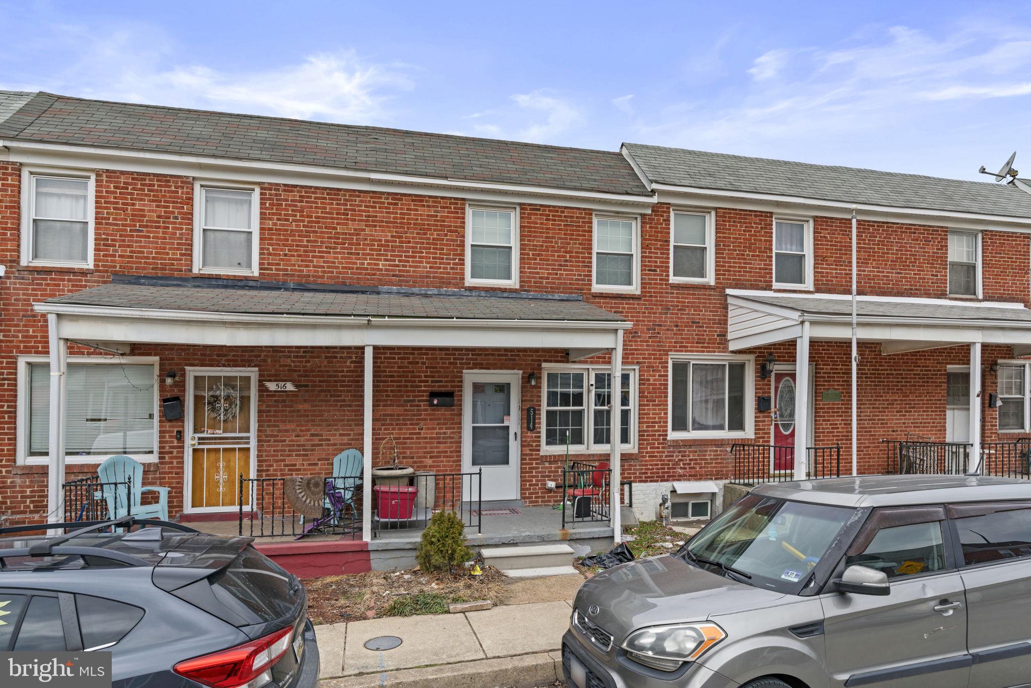514 Umbra Street Baltimore, MD 21224 - Photo 3 of 37 a front view of a house with outdoor space