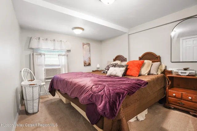 a bedroom with a bed and chair