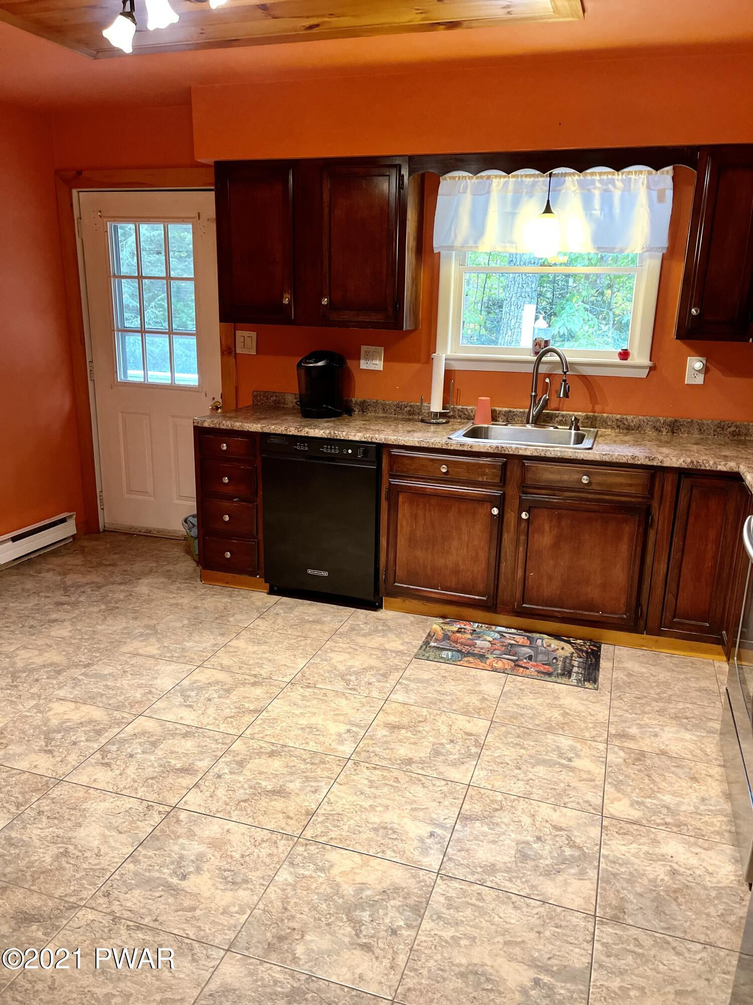 127 Estates Road Greentown, PA 18426 - Photo 55 of 85 a kitchen with a sink window and cabinets