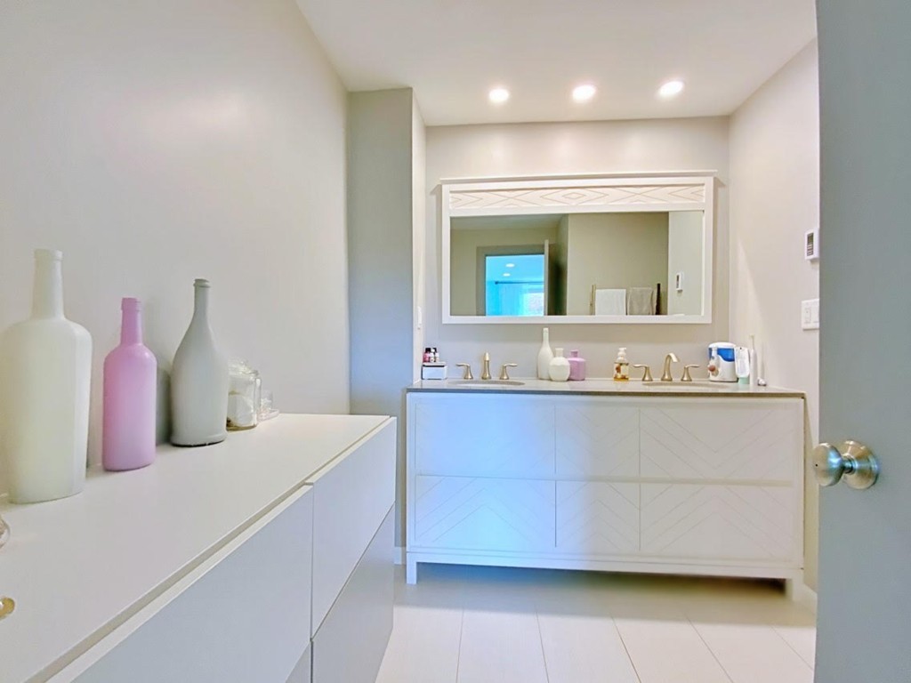 1206 Greendale Avenue, Unit 201 Needham, MA 02492 - Photo 18 of 26 a bathroom with a sink and a mirror