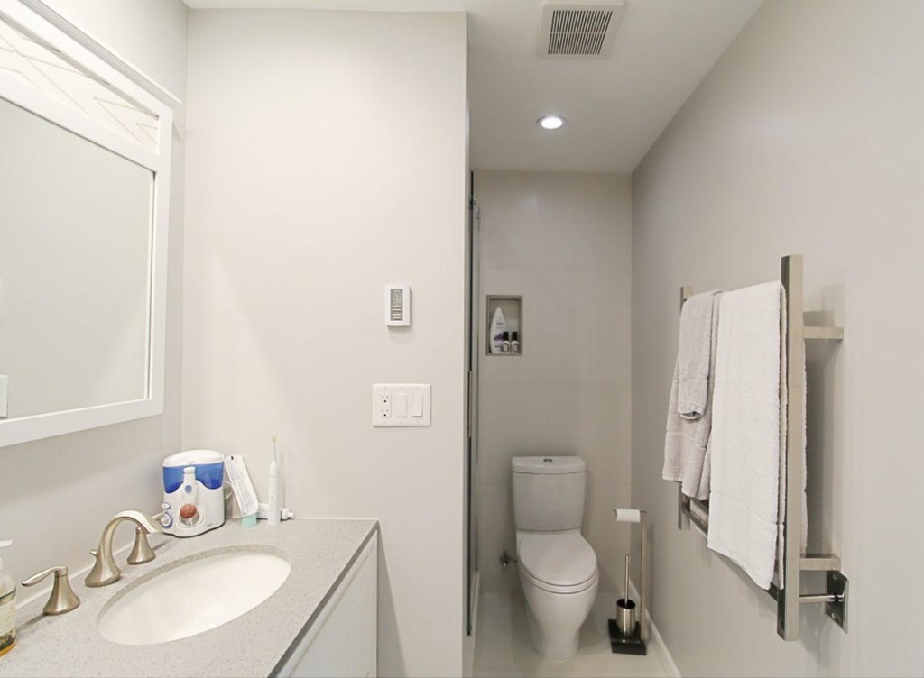 1206 Greendale Avenue, Unit 201 Needham, MA 02492 - Photo 19 of 26 a bathroom with a sink toilet and shower