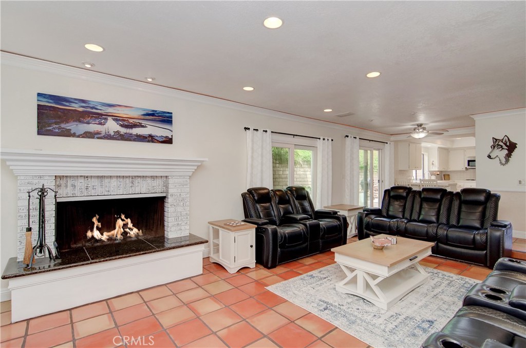 25095 Perch Drive Dana Point, CA 92629 - Photo 11 of 30 a living room with furniture a fireplace and next to a window