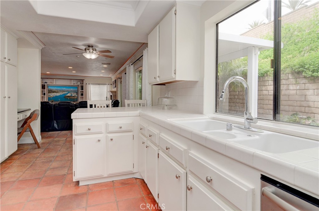 25095 Perch Drive Dana Point, CA 92629 - Photo 14 of 30 a kitchen with a sink cabinets and window