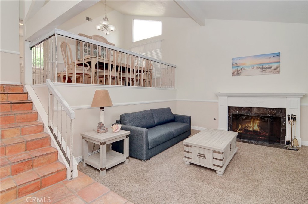 25095 Perch Drive Dana Point, CA 92629 - Photo 4 of 30 a living room with furniture and a fireplace