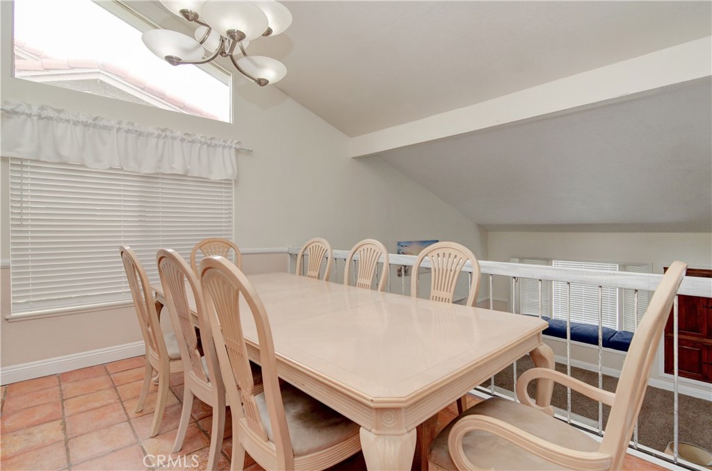 25095 Perch Drive Dana Point, CA 92629 - Photo 8 of 30 a view of a dining room with furniture and chandelier