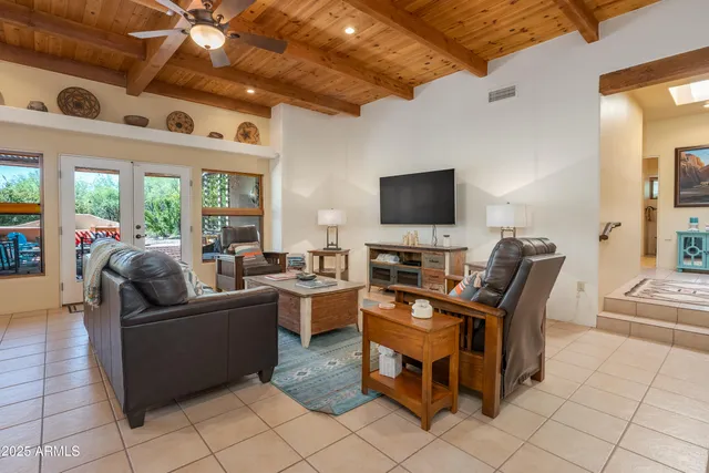 a kitchen with stainless steel appliances kitchen island granite countertop a refrigerator and stove