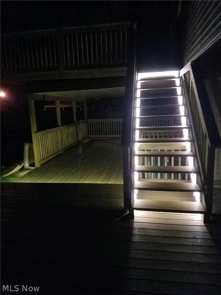 5472 Manning Circle North Ridgeville, OH 44039 - Photo 31 of 35 Lower level and stairs of deck lit up at night