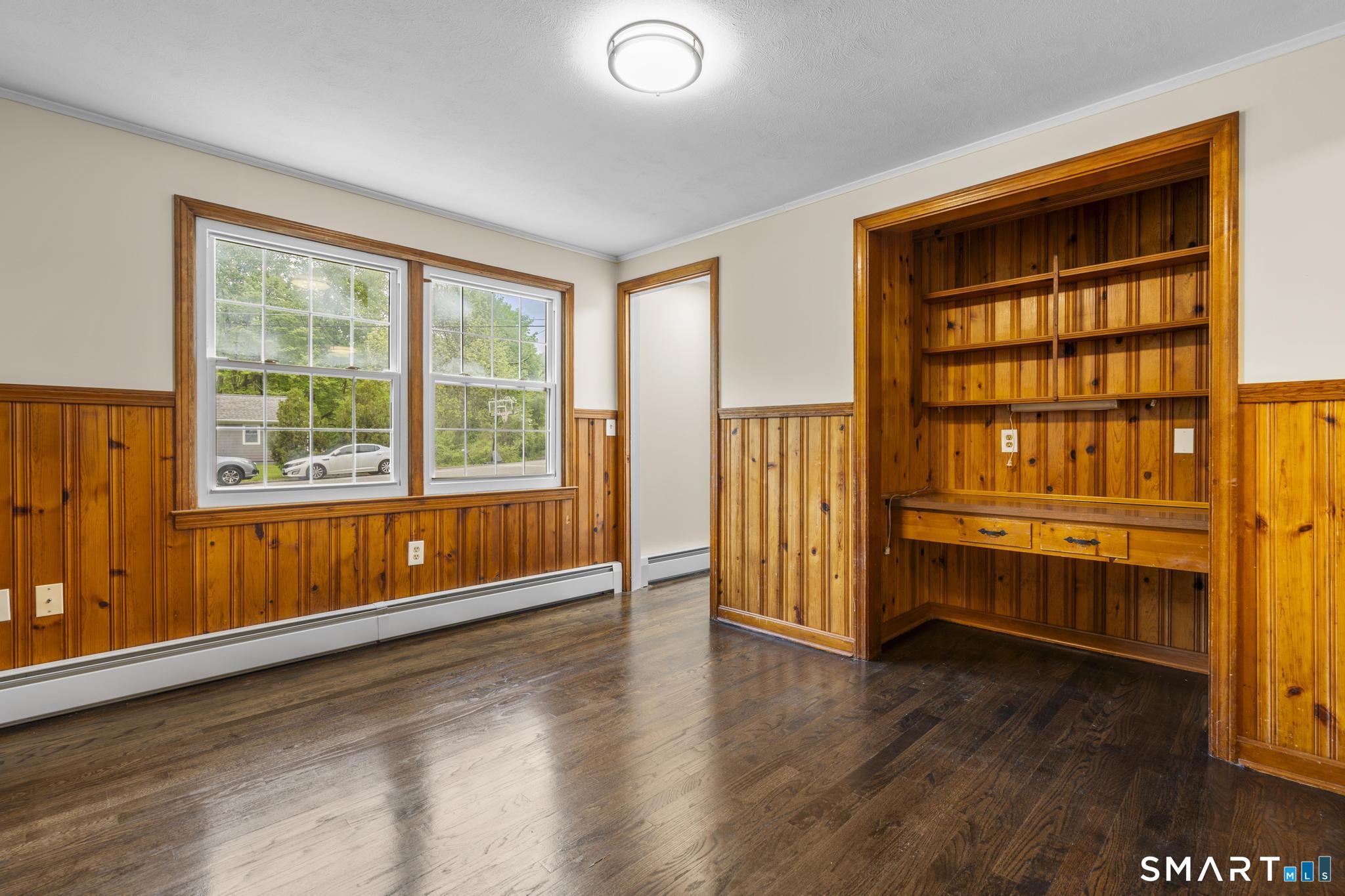 7 Sycamore Terrace Windham, CT 06280 - Photo 17 of 40 an empty room with wooden floor and windows