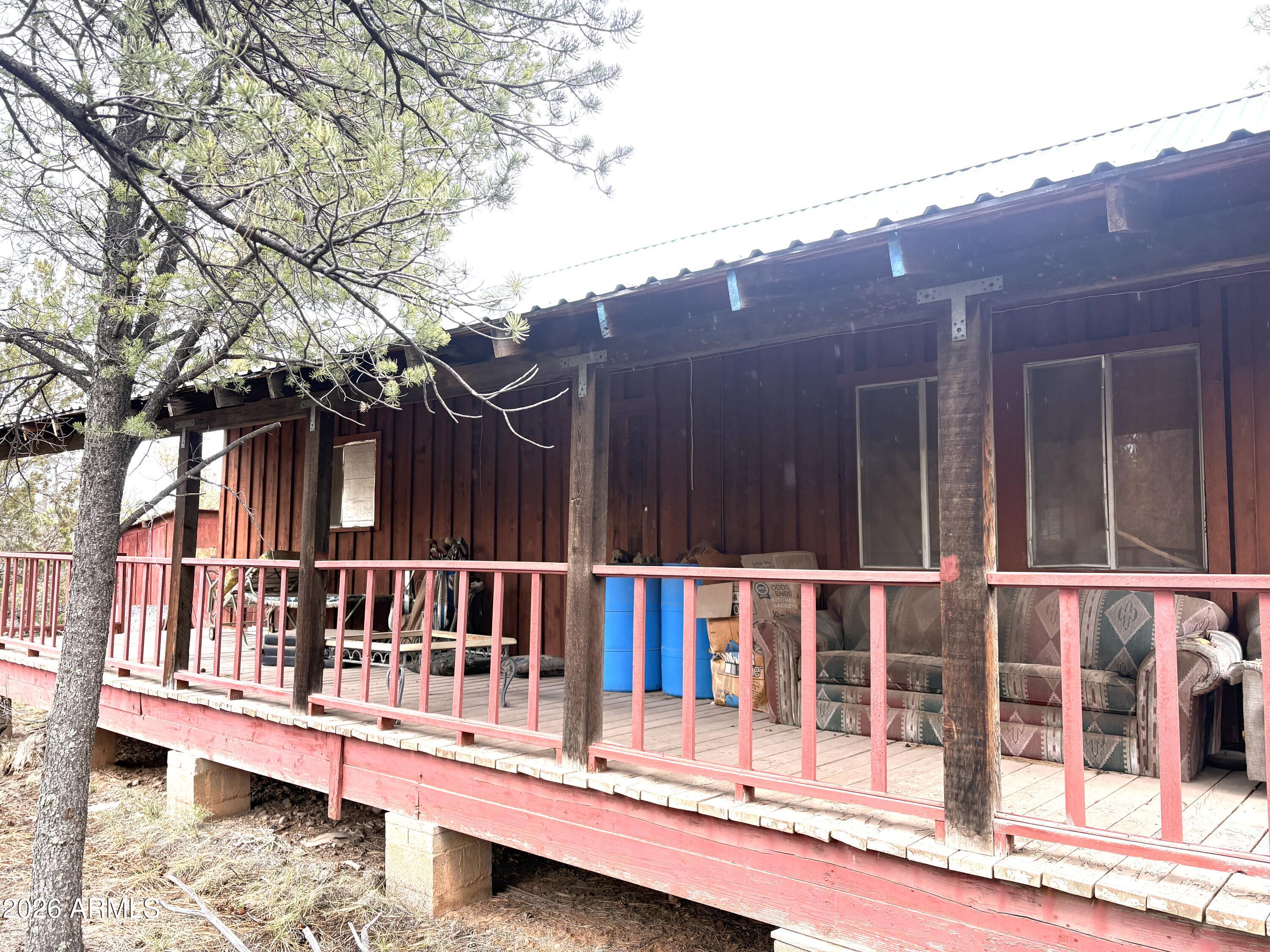 3130 Aspen Road Overgaard, AZ 85933 - Photo 9 of 30 Completely covered porch