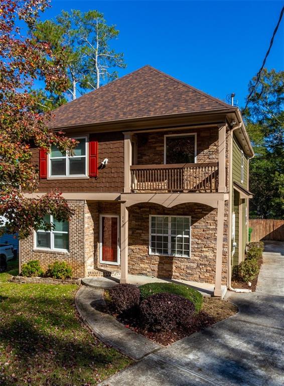 152 Nathan Road Southwest Atlanta, GA 30331 - Photo 1 of 1 a front view of a house with a garden