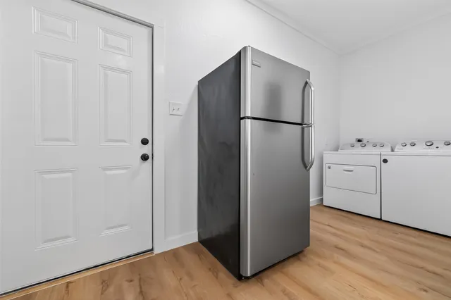 a view of cabinets and wooden floor