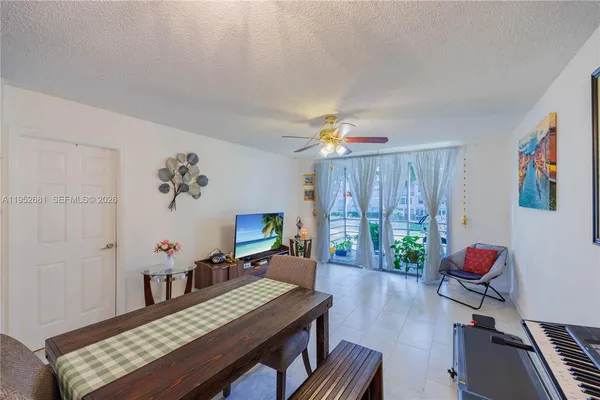 a view of a room with furniture and wooden floor