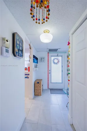 a view of a storage & utility room with a window