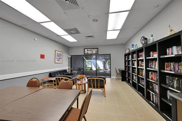 a view of a workspace with furniture